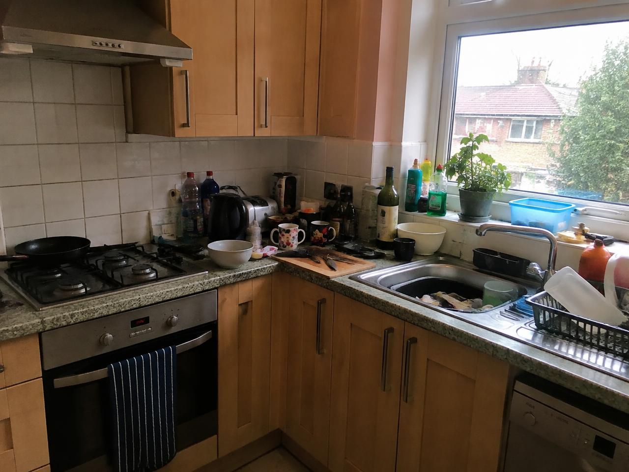 Illustrative kitchen before cleaning with spills and crumbs